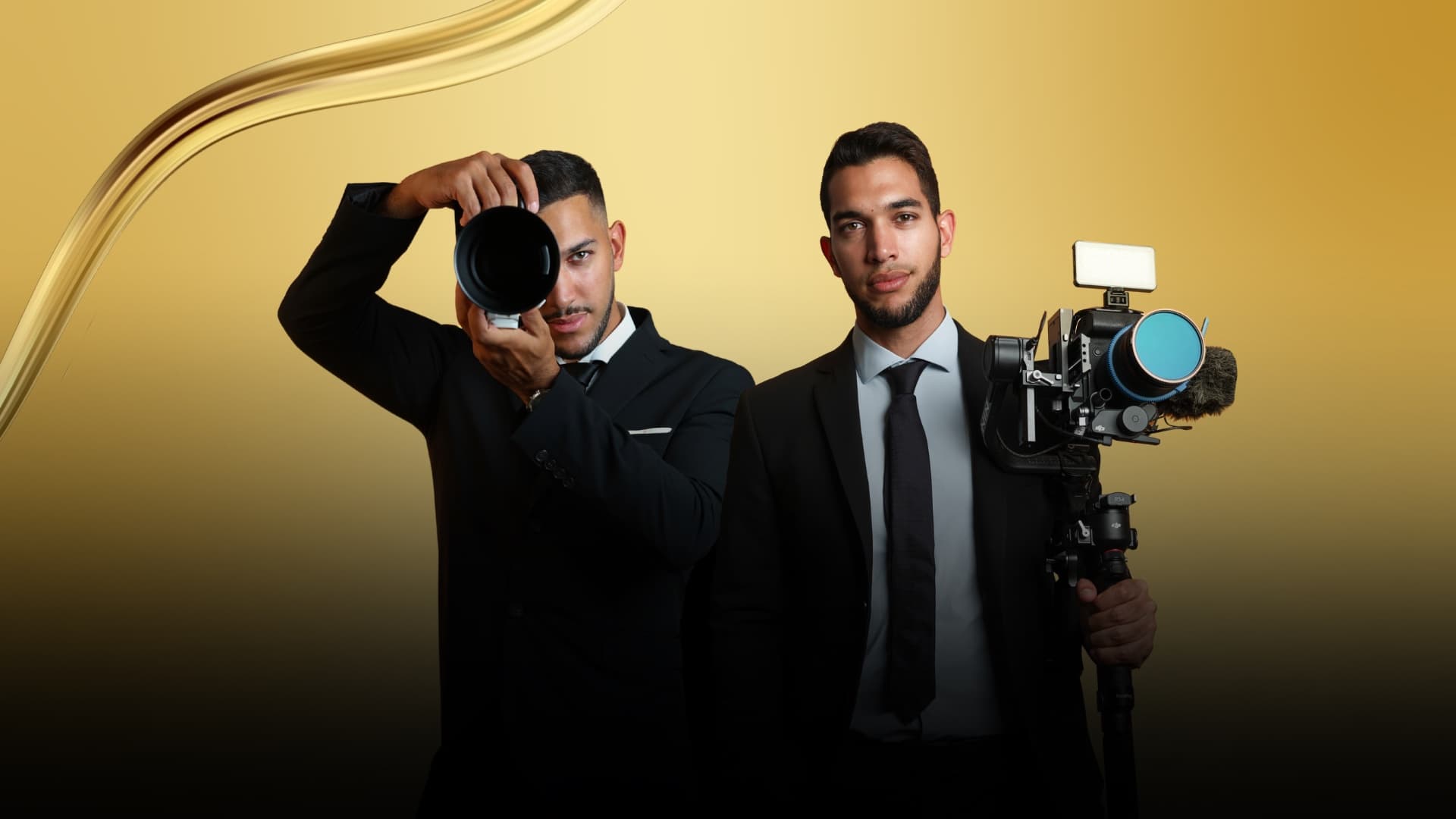 Magdi and Yousef with camera and gimbal against a gold backdrop