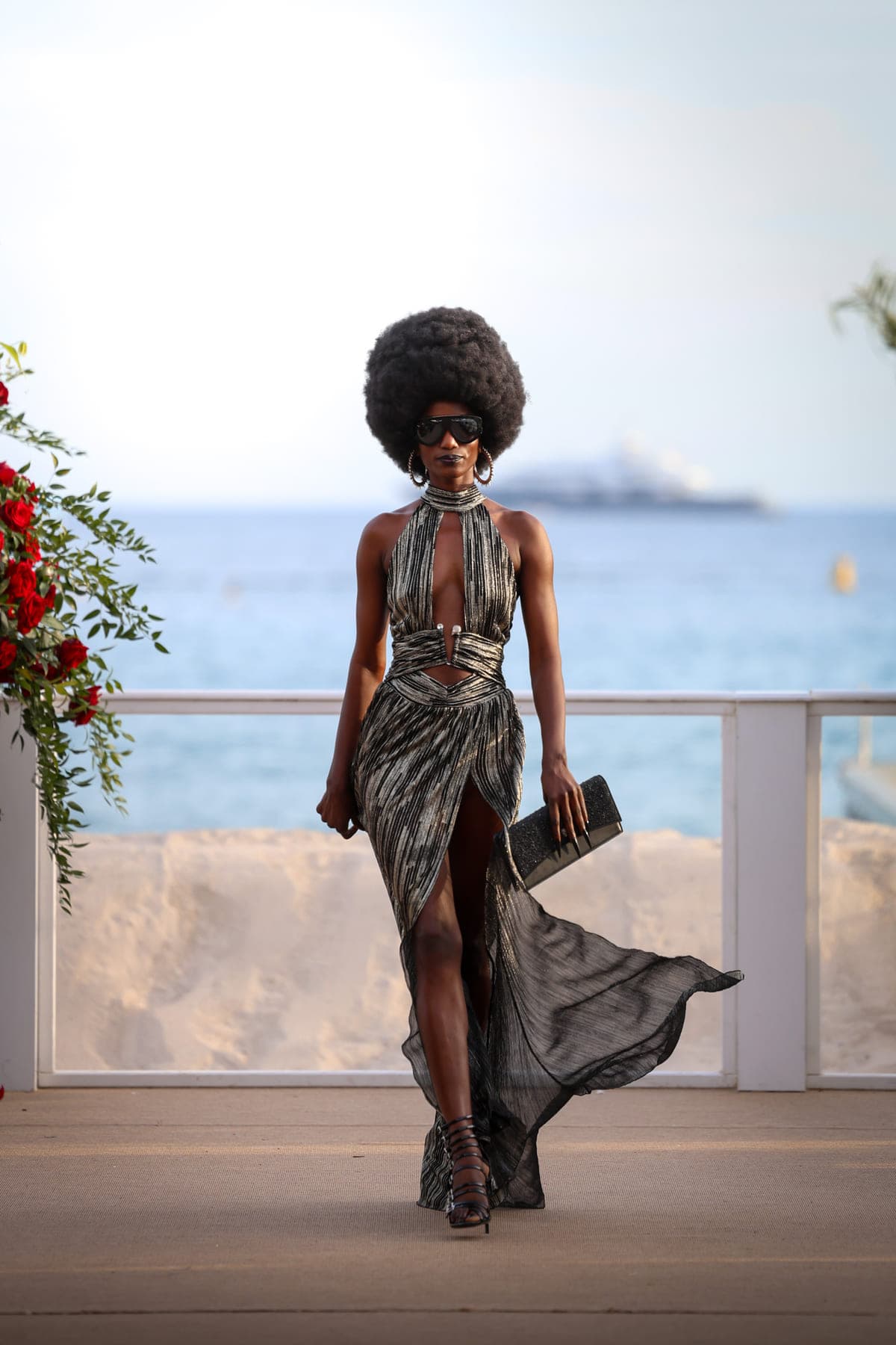 Gold gown against the sea on the Croisette, Cannes